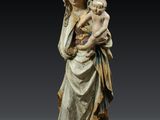 a statue of a woman holding a child in her arms