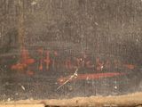 a painting on the wall of a building with writing on it