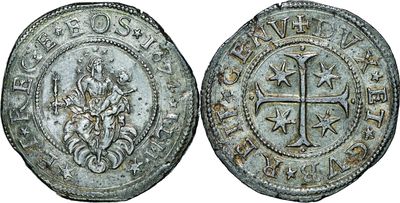 a silver coin with an image of a cross on it