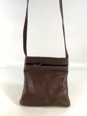 a brown leather purse with a zipper on the top of it