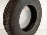 a close up of a tire on a white surface