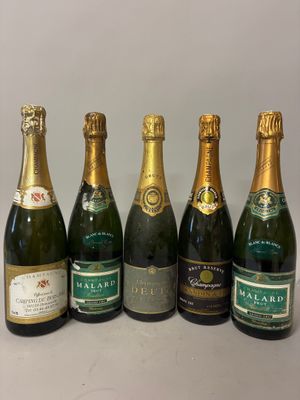 six bottles of champagne are lined up in a row on a table