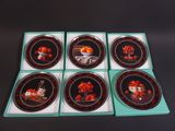 six plates with a picture of a man and a woman on them