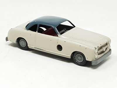 a toy car that is sitting on a white surface