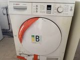 a washer and a dryer in a small room