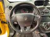 dashboard of a small car with a steering wheel and dashboard controls