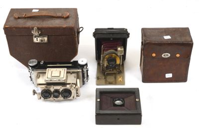 several different types of old cameras and boxes on a white surface