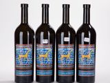 three bottles of wine sitting next to each other on top of a table