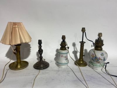 three lamps and a lamp shade sitting on a white surface