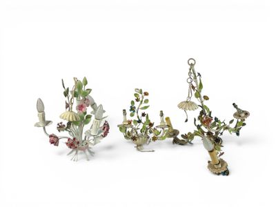 three figurines of birds and flowers on a white surface