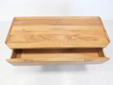 a close up of a wooden table with a drawer in it
