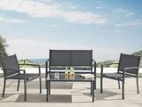the patio furniture is set up on a patio with a table and chairs