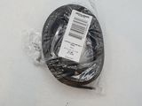 a black cable wrapped in plastic on a white surface