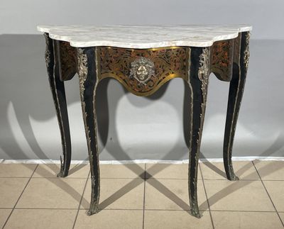 a small table with a marble top on a tiled floor
