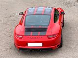 a red sports car parked in a parking lot