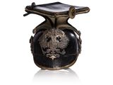 a black vase with a dragon on it sitting on a table