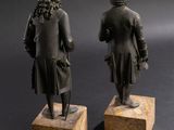 pair of bronze figures of a man and a woman on marble bases