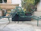 four chairs and a table on the patio