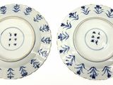 two plates with blue and white designs on them