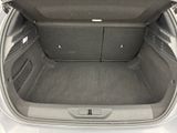 a trunk of a white car with its doors open