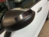 an image of a car door mirror with a sticker on it