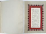 an open book with a picture of a red border on it