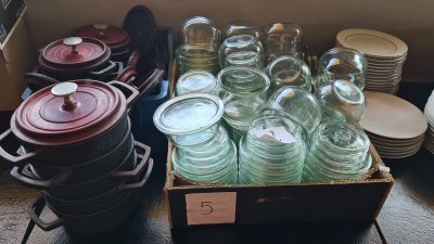 many jars and pans sitting on a table
