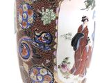 a vase with a picture of a woman on it
