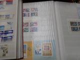 a open book with stamps on it sitting on a table