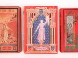 three different types of playing cards sitting on top of a white surface