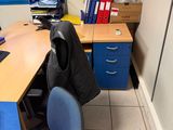 a desk with a chair and a computer on it