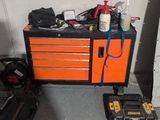 a tool box with tools on top of it next to a tool box