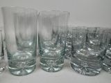 a lot of glasses that are sitting on a table