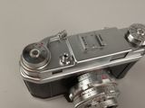 a silver camera that is sitting on a table