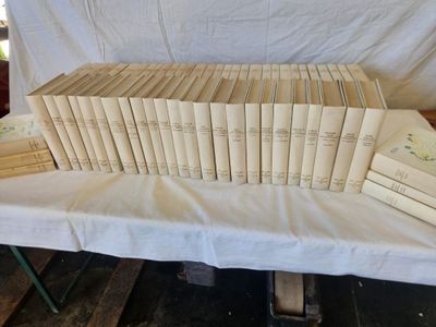 a lot of books that are on a table