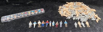 a lot of small toy figurines and a remote control