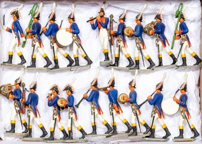 many figurines of soldiers that are in a box