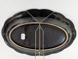 a picture of a ceiling light with a black glass shade