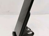 a cell phone that is sitting on a stand