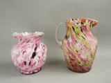 two vases sitting next to each other on a table