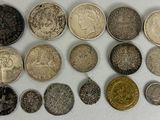 an image of a group of coins sitting on top of a white surface