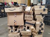 many boxes stacked on top of each other in a warehouse