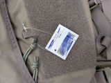 a tag on the back of a backpack that has a tag attached to it
