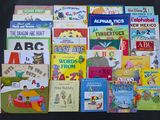 many children ' s books that are on the table