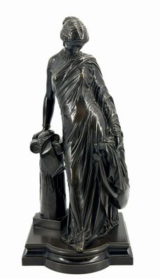 bronze statue of a woman with a dog on a marble base