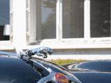 a black car parked in front of a building