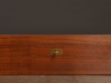 a wooden box with brass hardware on a table