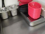 many bowls and pans on the counter in the kitchen