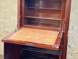a small wooden desk with a drawer on top of it