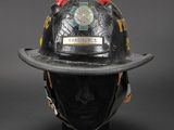 a close up of a fireman ' s helmet on a mannequin head